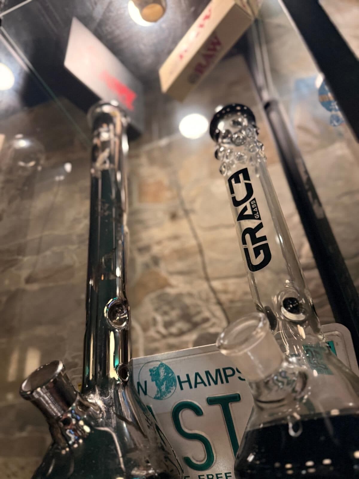Backlit Grace glass piece on the bar
