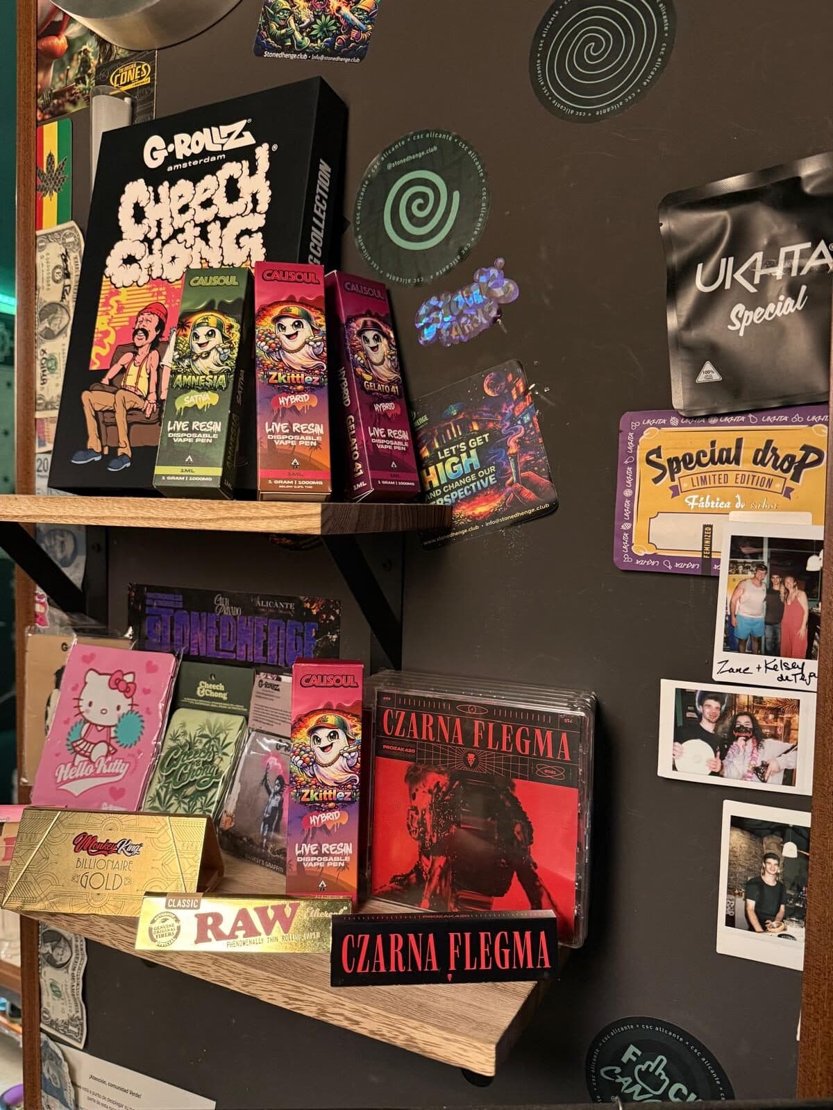 Merchandise wall of rolling papers, tins and prints